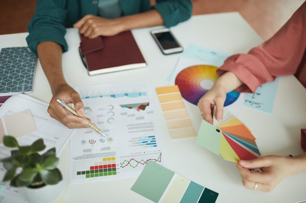 People discussing business graphics
